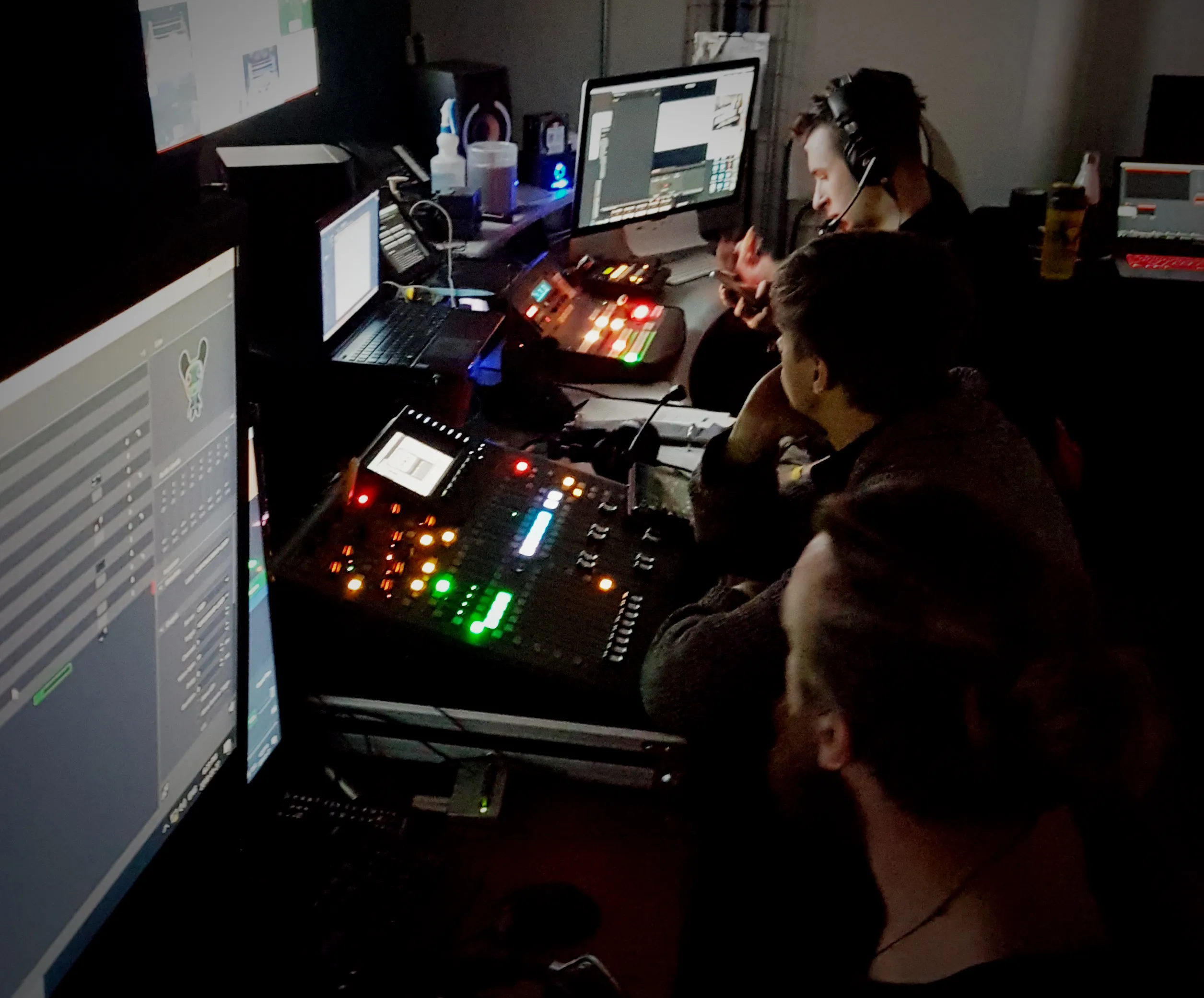 tech crew working hard behind the scenes of the event using switchers