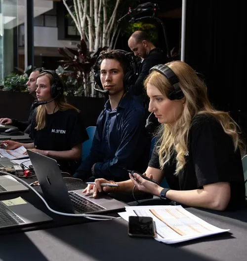 maven crew working on set for the plug and play event