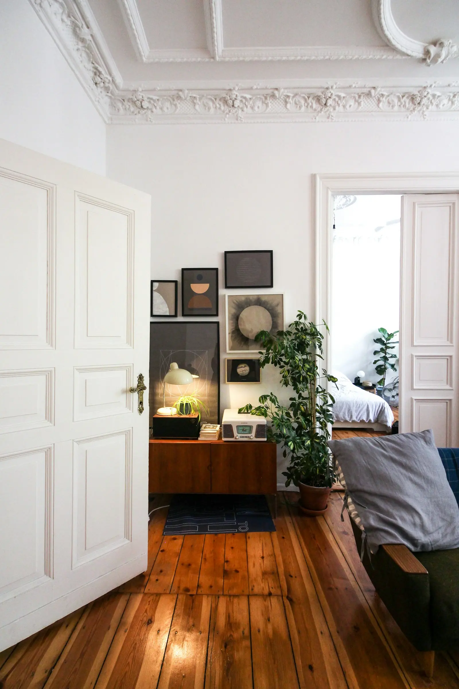 Bright furnished studio apartment with desk and large window