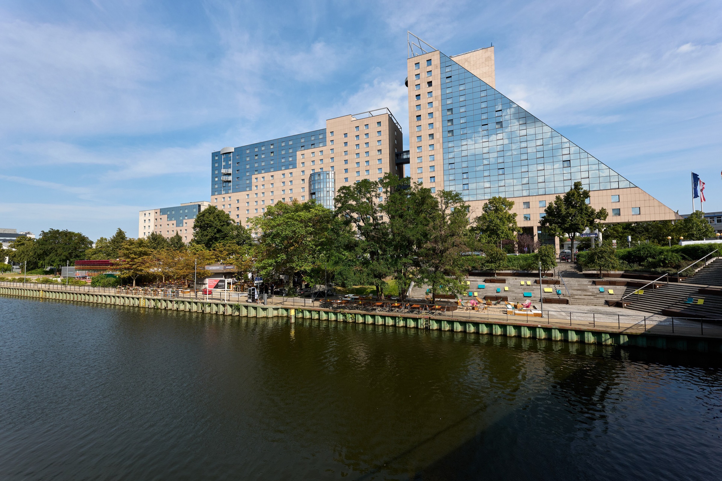 The Estrel Berlin hotel and congress centre on the Neukölln Ship Canal on a sunny day