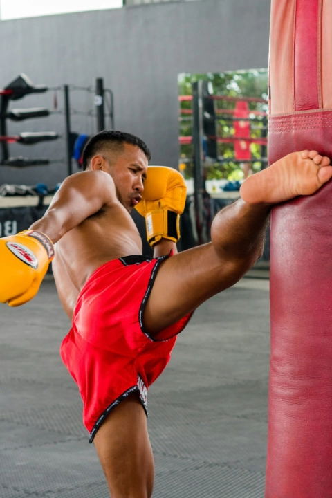 Muay Thai Athlete Roundhouse Kick Heavy Bag Training