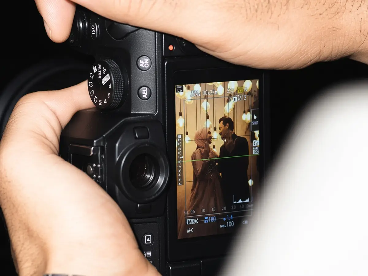 Photographer reviewing a shot on camera