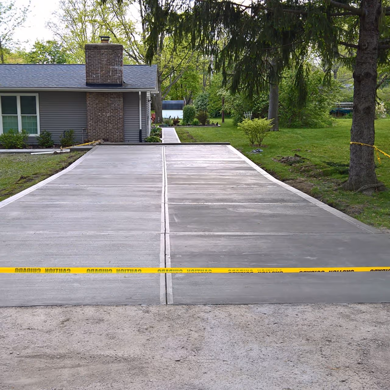 Concrete driveway installation with durable finish for long-lasting performance and curb appeal by Landa Construction Services