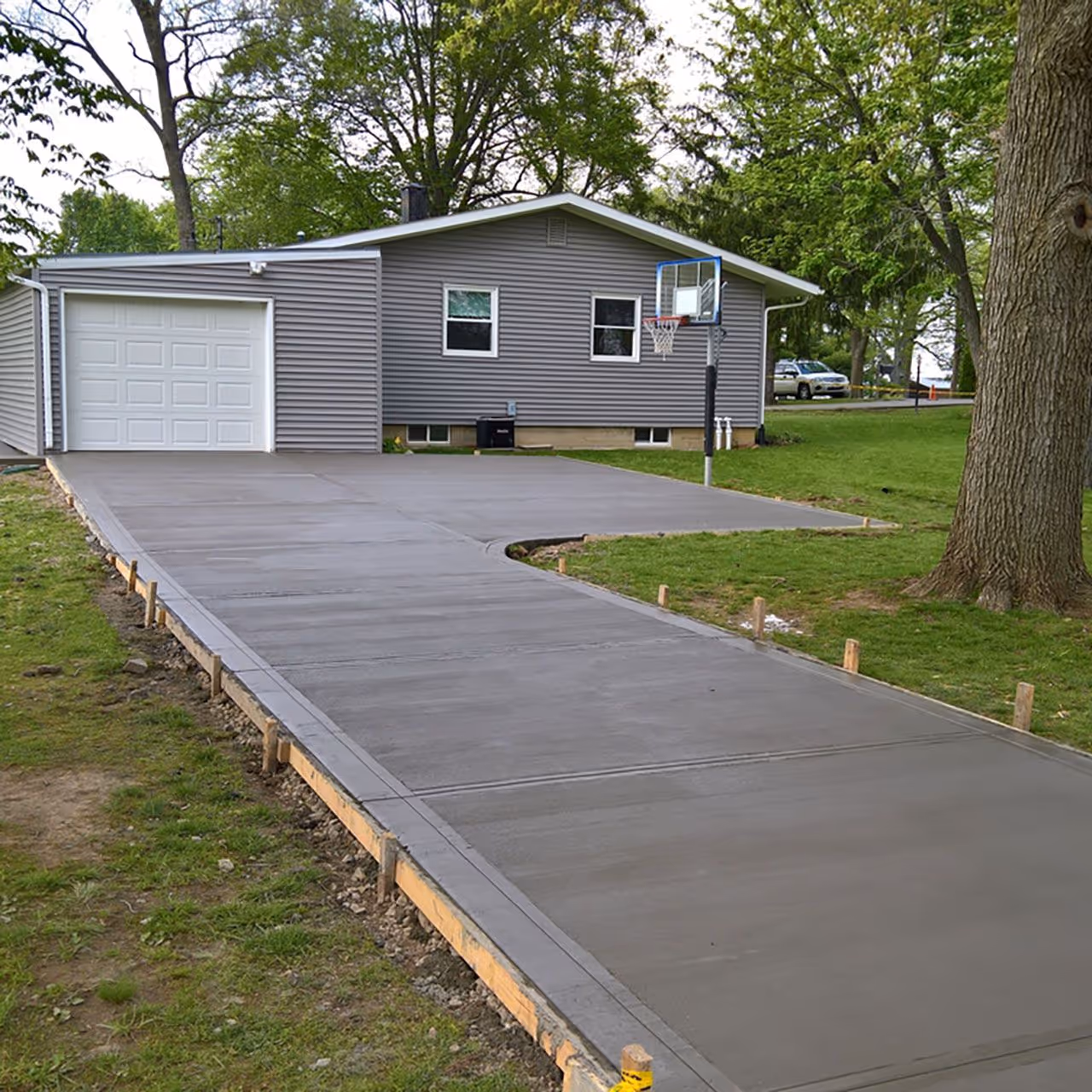Concrete driveway installation near me with smooth finish