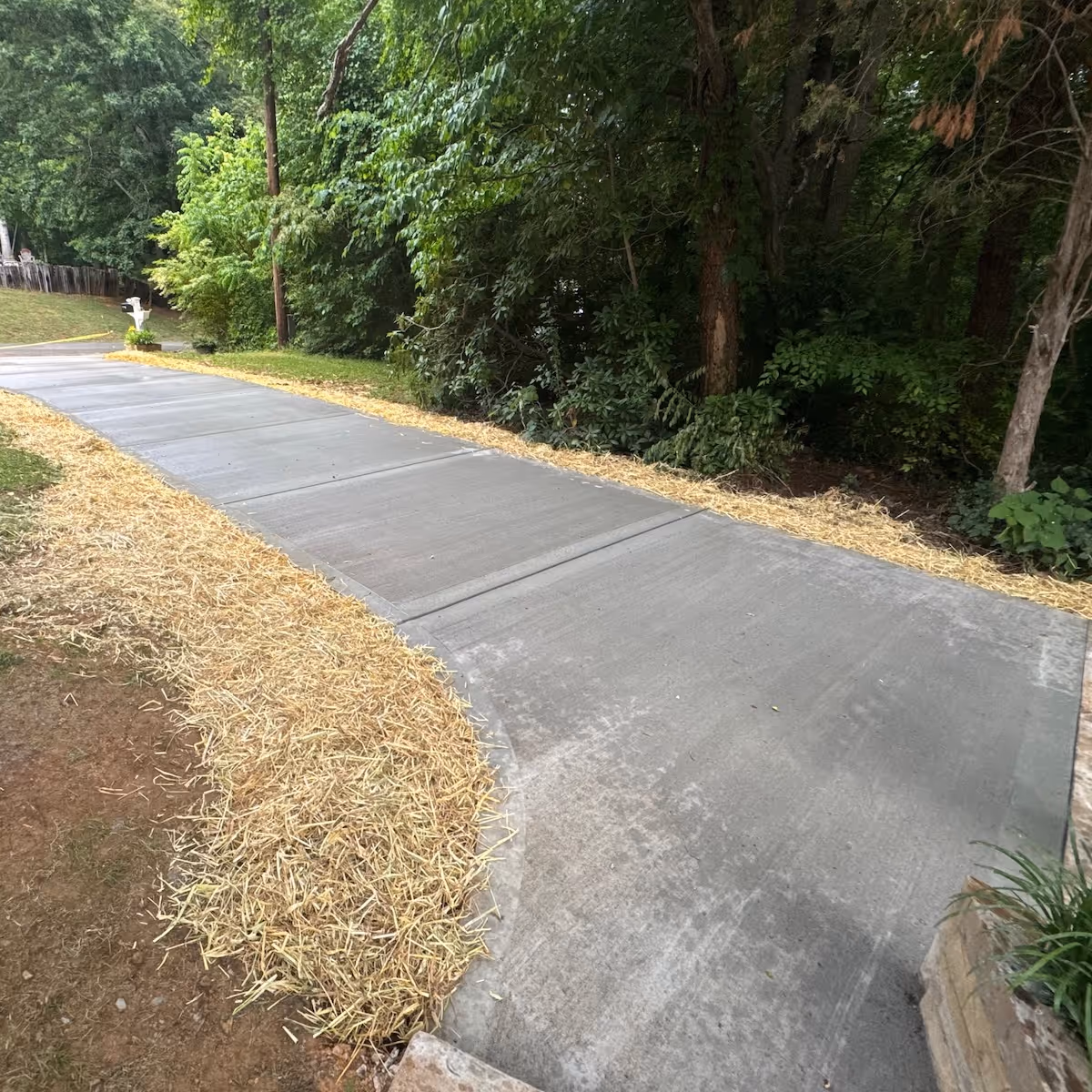 Custom concrete driveway construction providing a strong, attractive entrance to the property by Landa Construction Services.