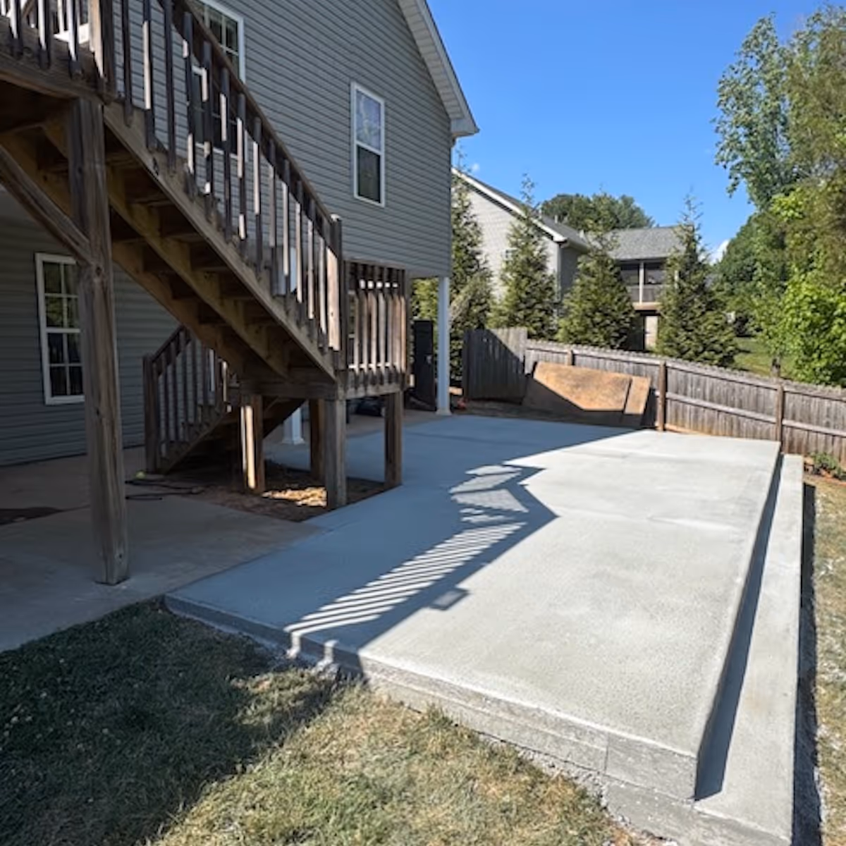 Custom concrete patio construction for outdoor living and entertainment spaces