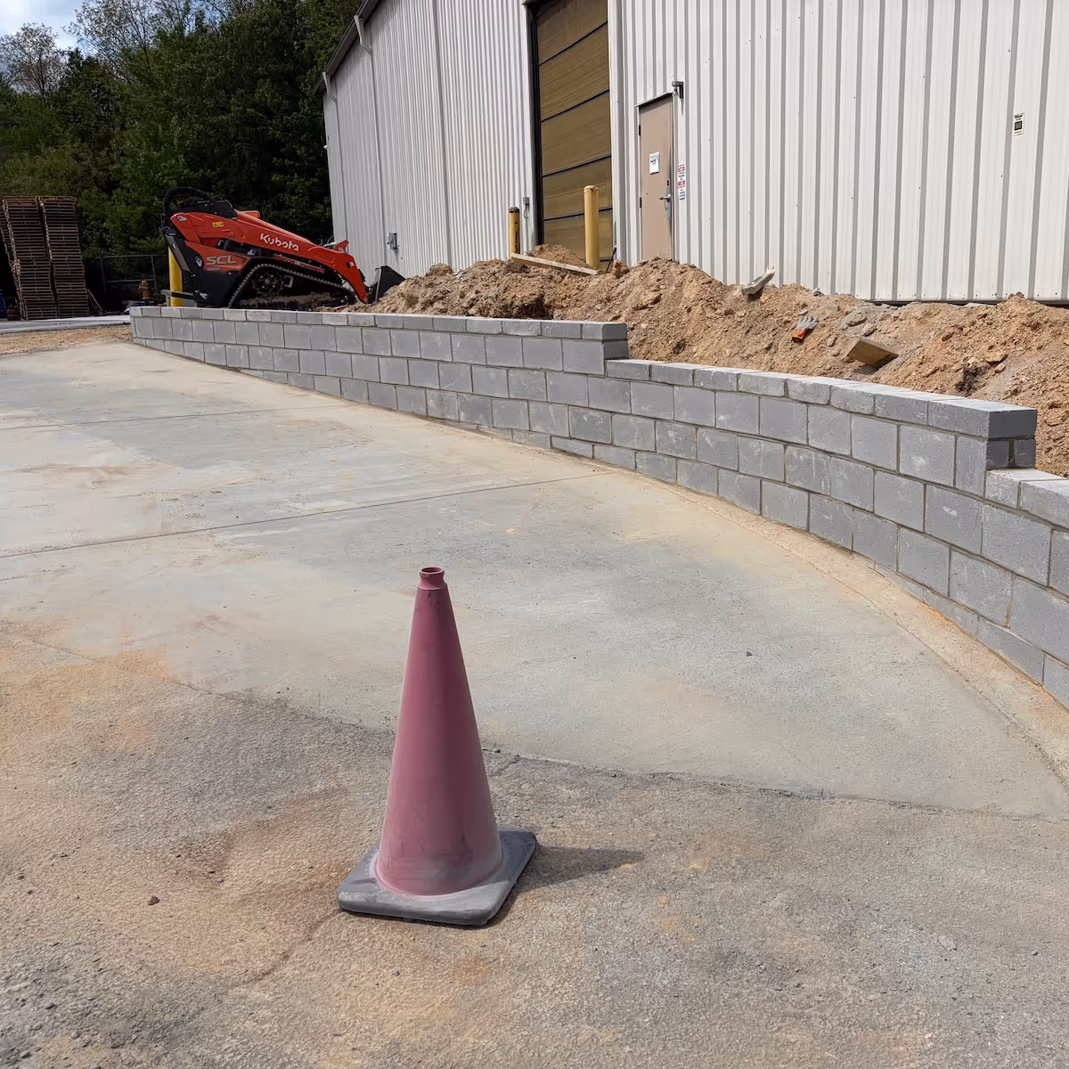 Retaining wall installation providing structural support, erosion control, and enhanced landscape design by Landa Construction Services.