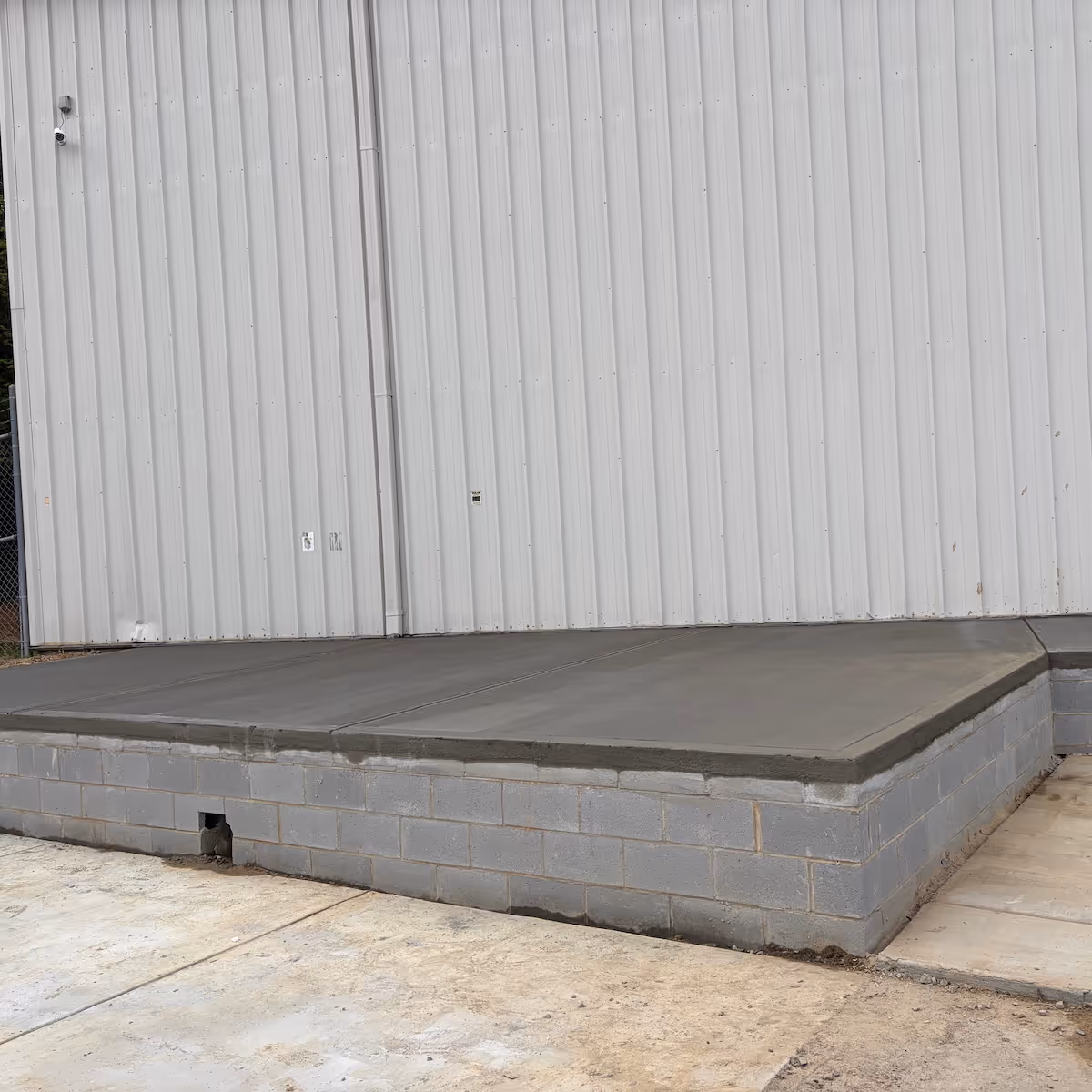 Concrete unloading dock construction built for heavy-duty commercial use, durability, and efficient loading operations by Landa Construction Services.