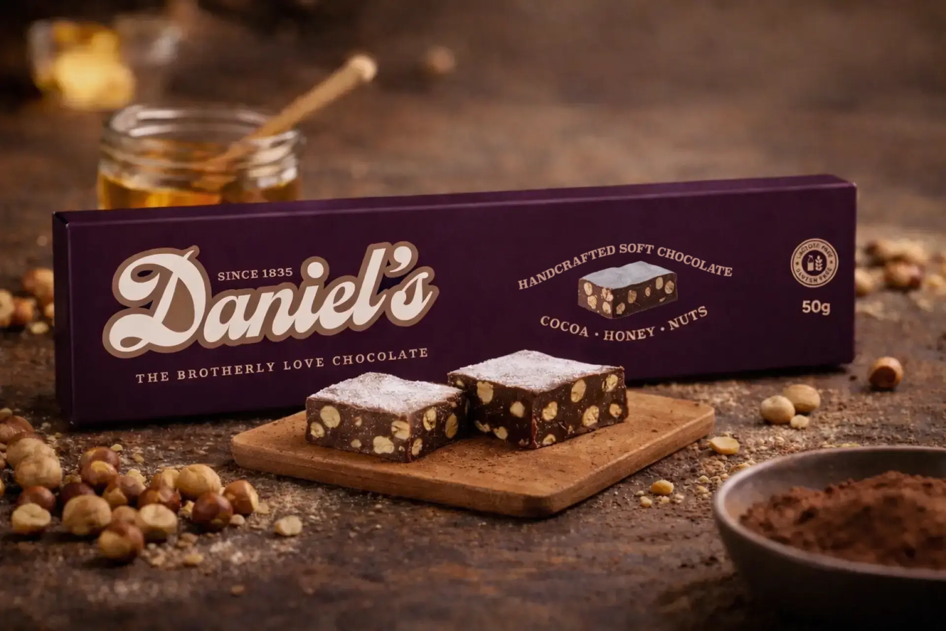 Daniel's Chocolate surrounded by ingredients and product samples