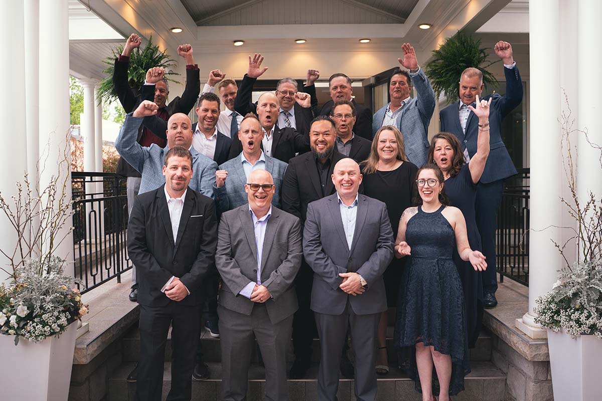company staff of 13 people gathered for a photo