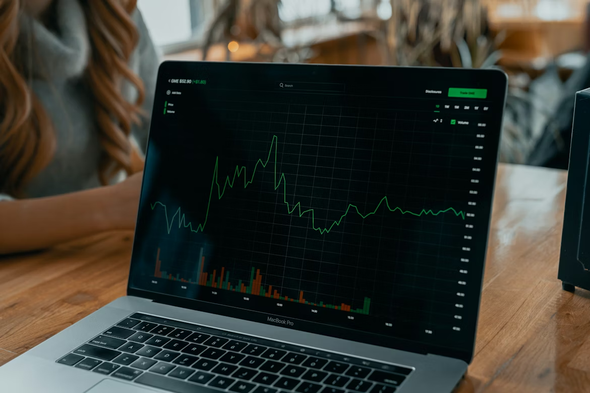 Laptop displaying market performance data, representing the identification of high-potential healthcare technology and services.