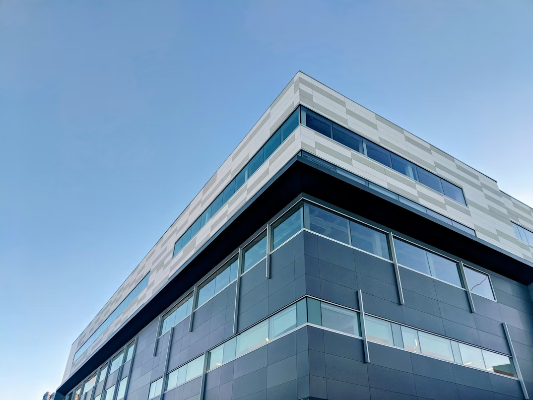 Modern office building exterior representing institutional healthcare investment and long-term infrastructure focus.