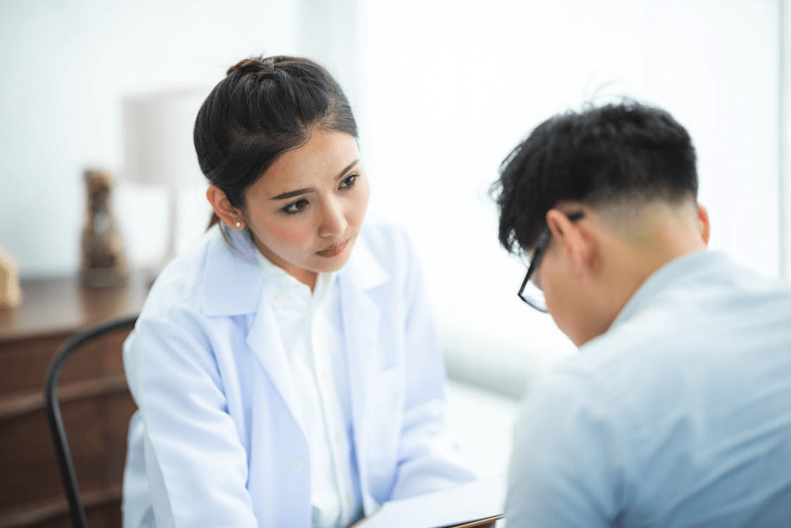 Two healthcare providers collaborating in a modern clinic, reflecting The Y Factor’s integrated approach to men’s reproductive and hormonal health.