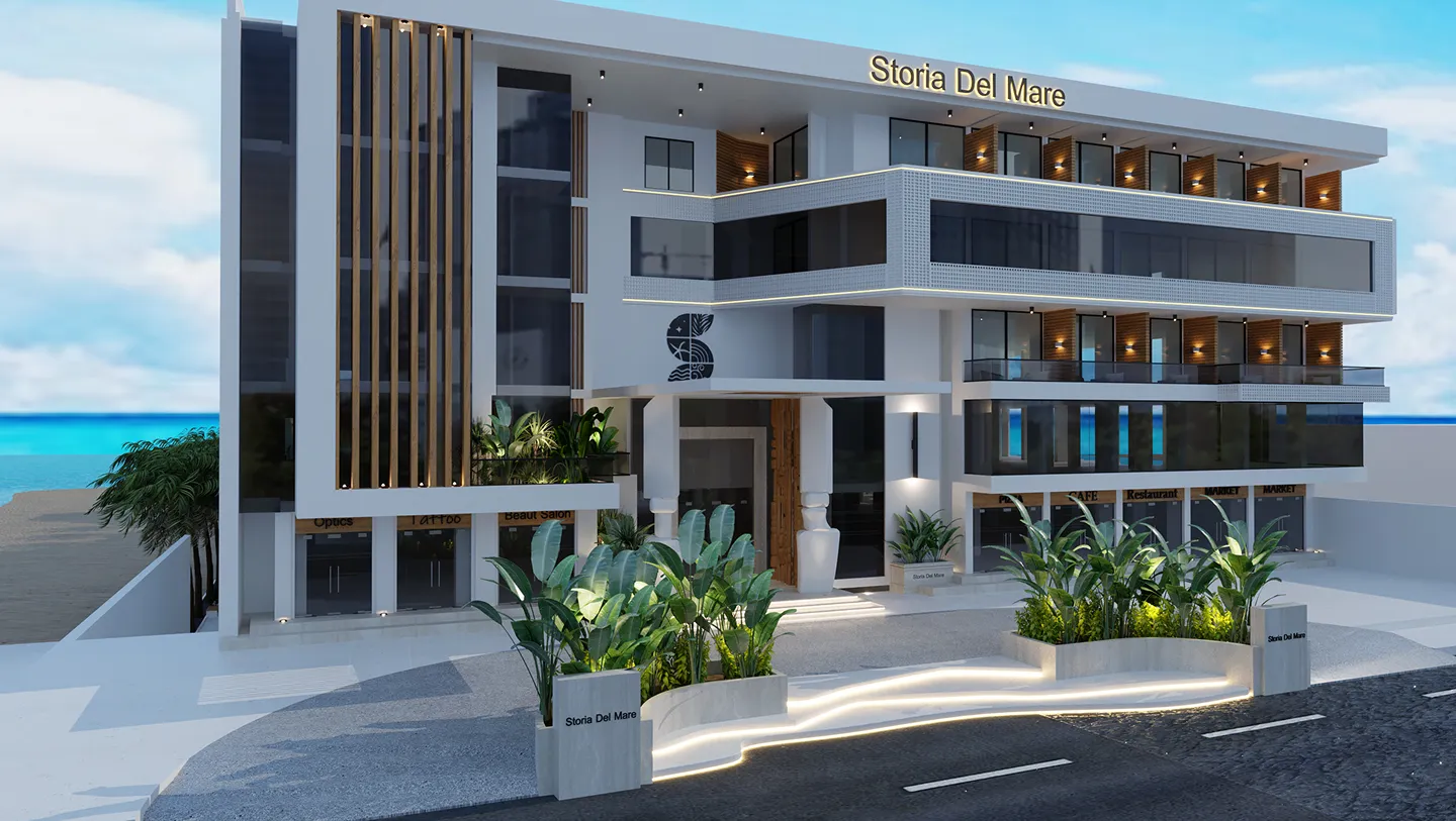 Modern multi-story building named Storia Del Mare with glass balconies, exterior greenery, and a view of the ocean in the background.