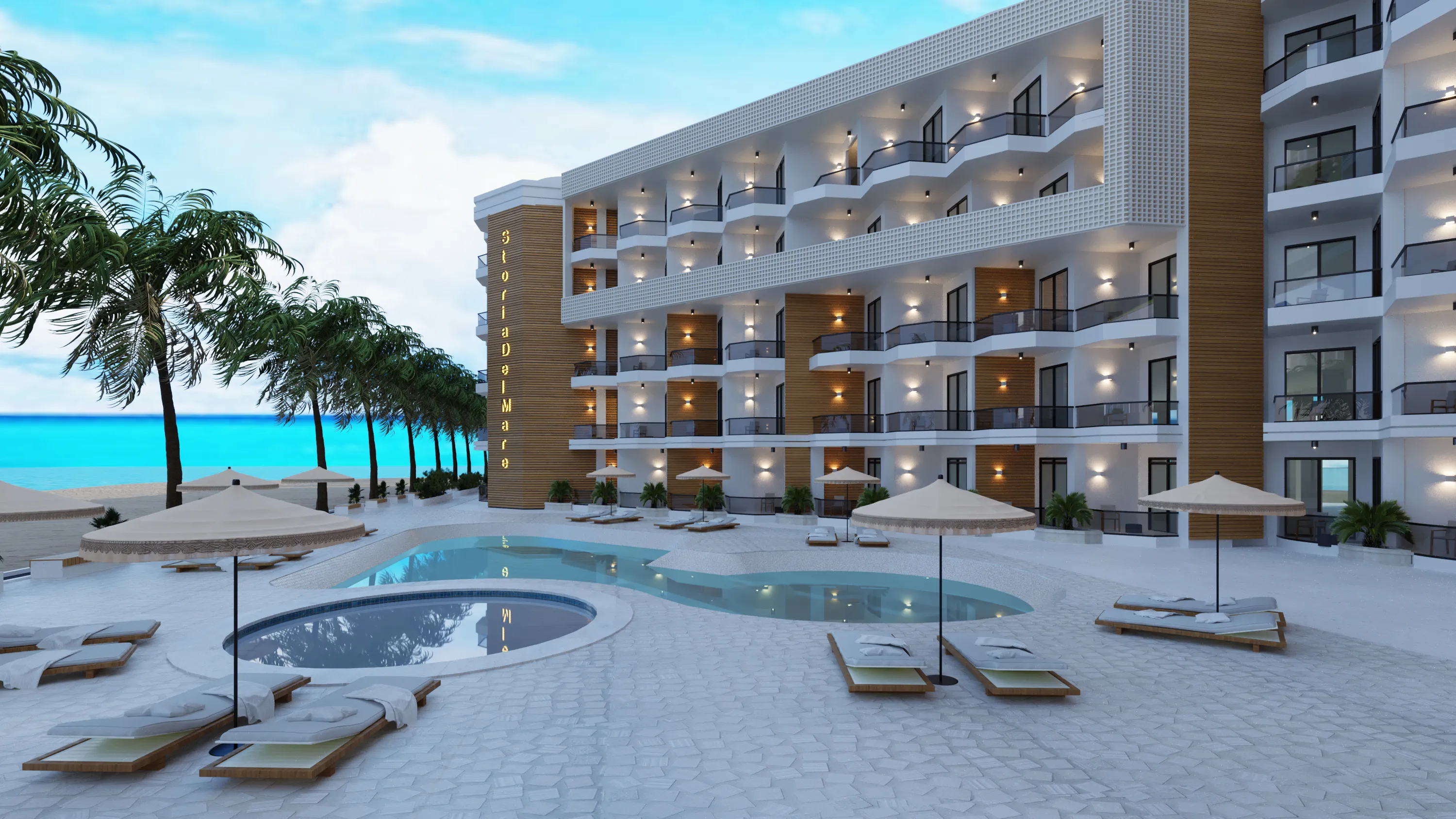 Modern beachfront hotel with multiple balconies, pool, lounge chairs with umbrellas, and palm trees along the coast.
