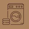 Icon of a front-loading washing machine with folded towels beside it.
