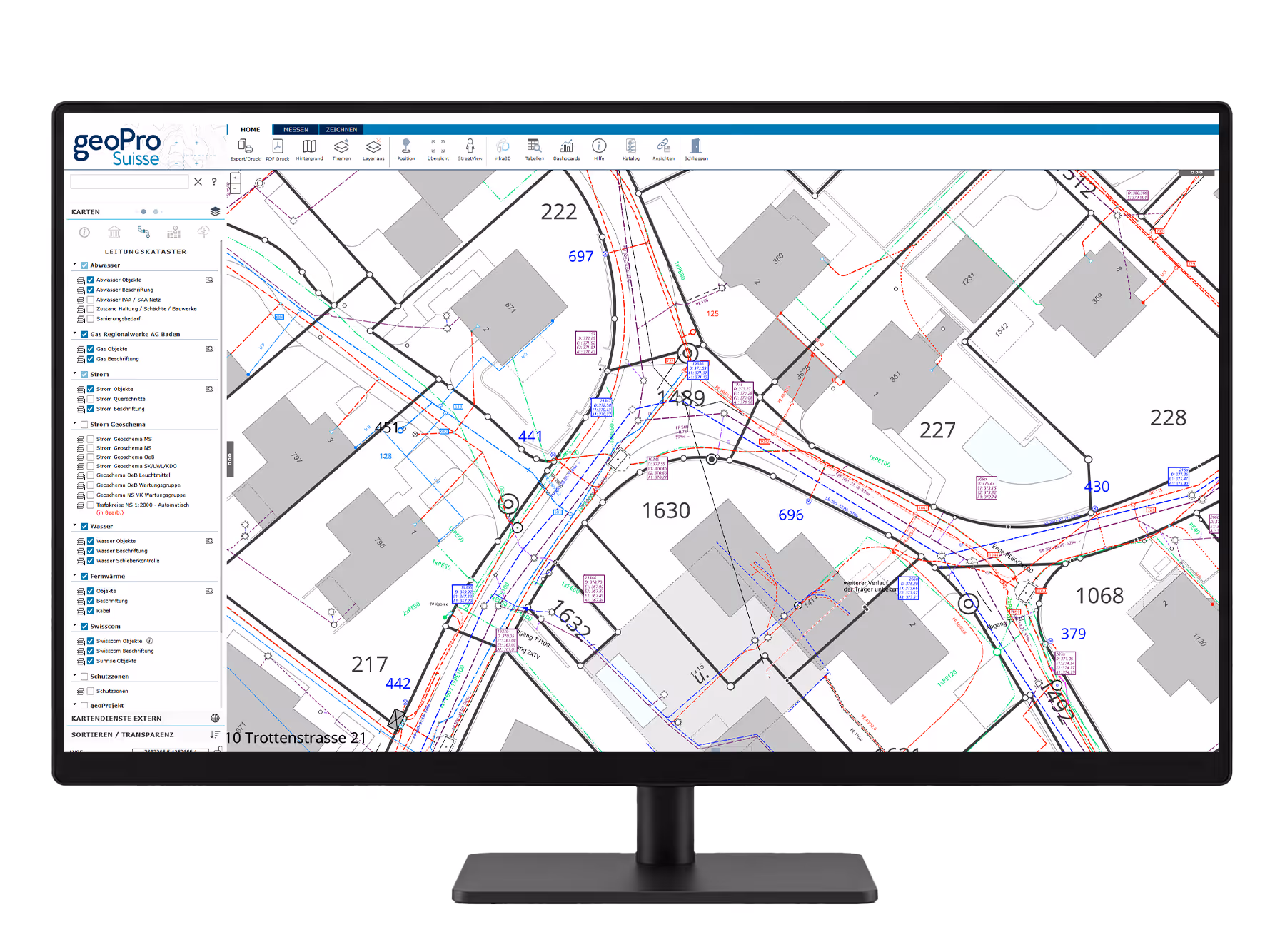 Monitor zeigt eine digitale Karte mit Gebäuden, Leitungen und Infrastrukturdaten im geoPro Suisse Geoportal.