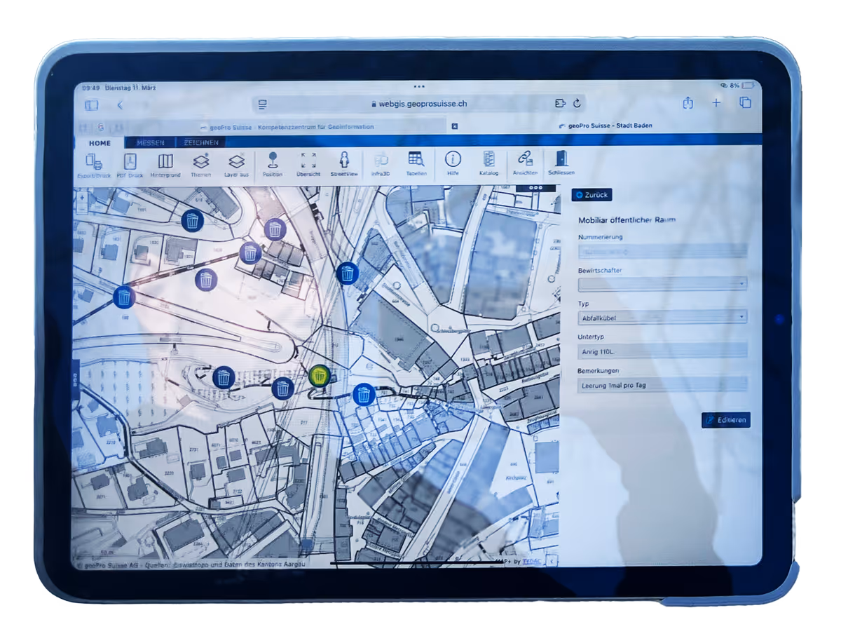 Tablet screen displaying a detailed map interface from webgis.geoprosuisse.ch with icons for public waste bins and a form for editing bin details.