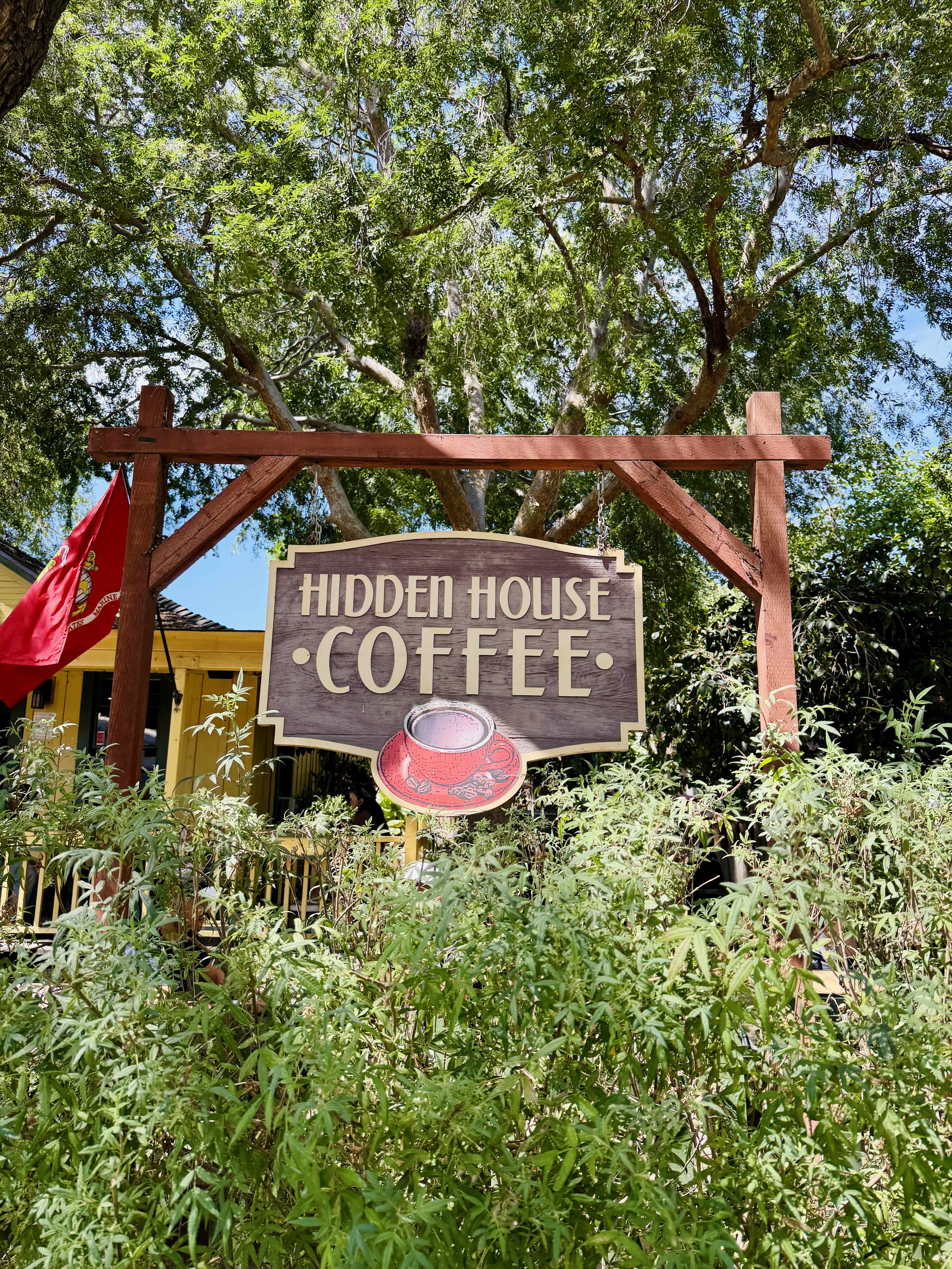 Hidden House Coffee sign at the historic Los Rios Street location