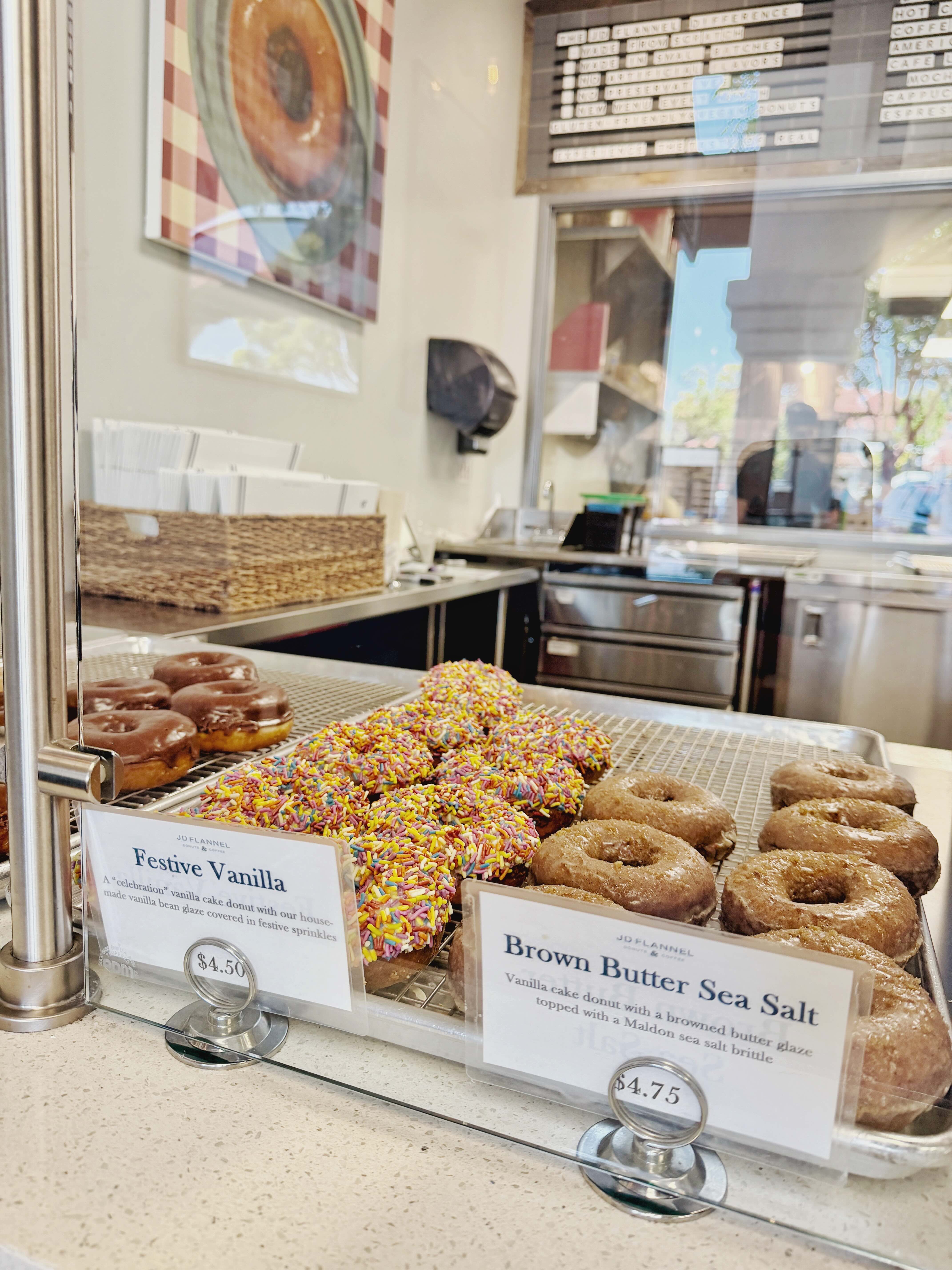 Close-up of JD Flannel Donuts — craft donuts with house-made glazes and seasonal toppings, including the signature maple bacon