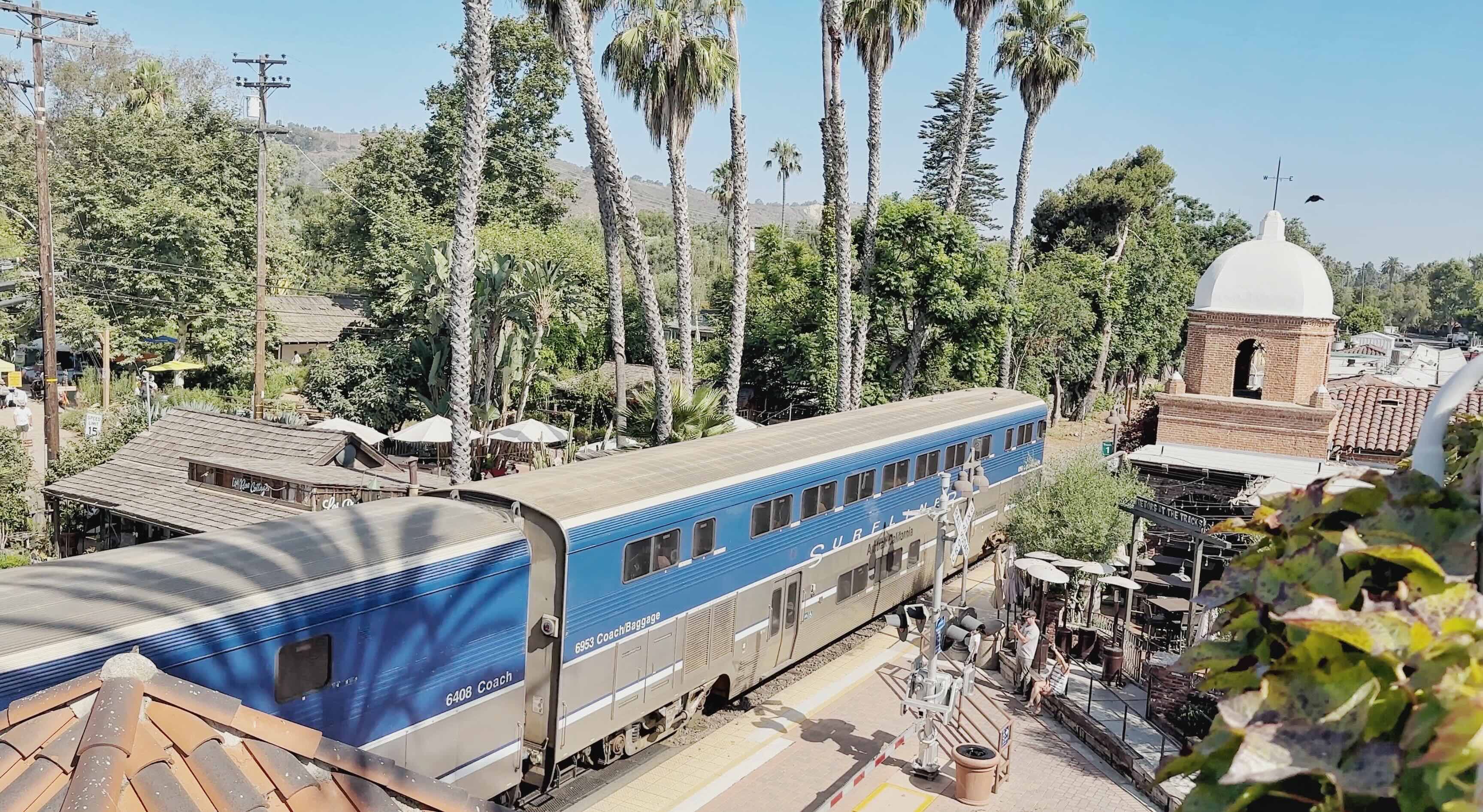 Pacific Surfliner passenger train moving along the rail corridor immediately east of Los Rios Street in San Juan Capistrano, the active line that forms the eastern edge of the historic district.
