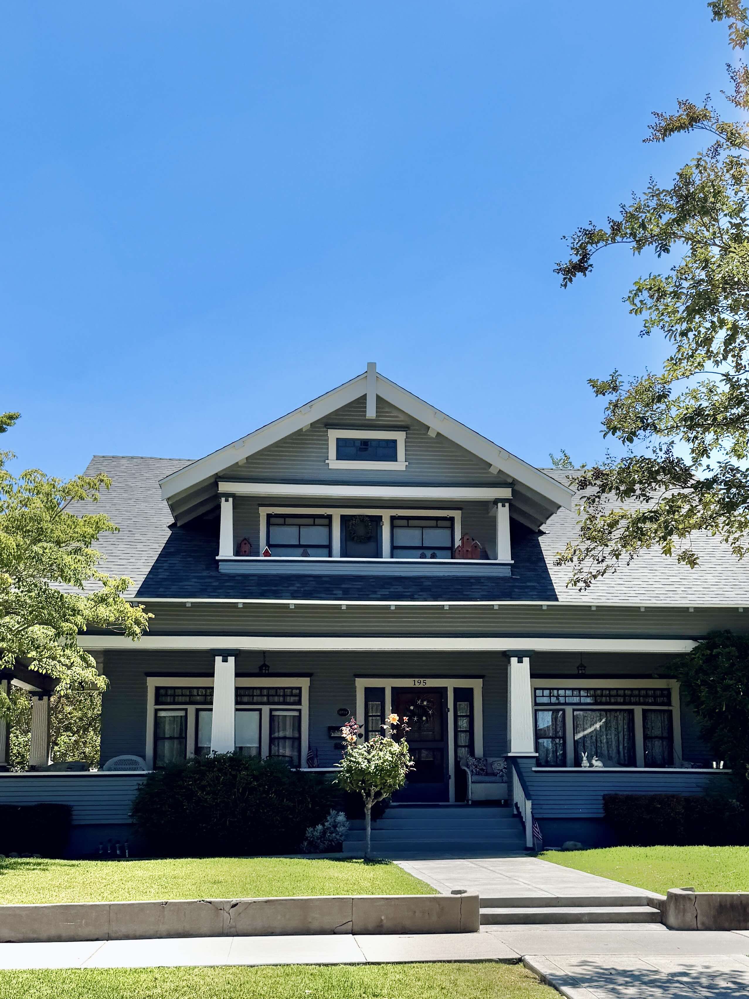 A Craftsman-style residence in Old Towne Orange. Tapered columns and low-pitched roof characteristic of the district's 1900s to 1920s bungalow housing stock.