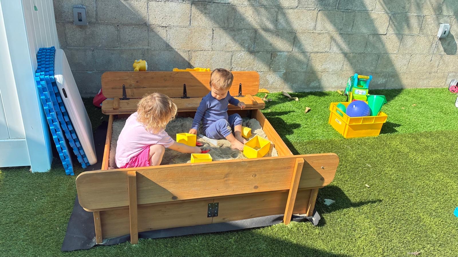 Backyard sandbox area at Little Genius Home Daycare OC.