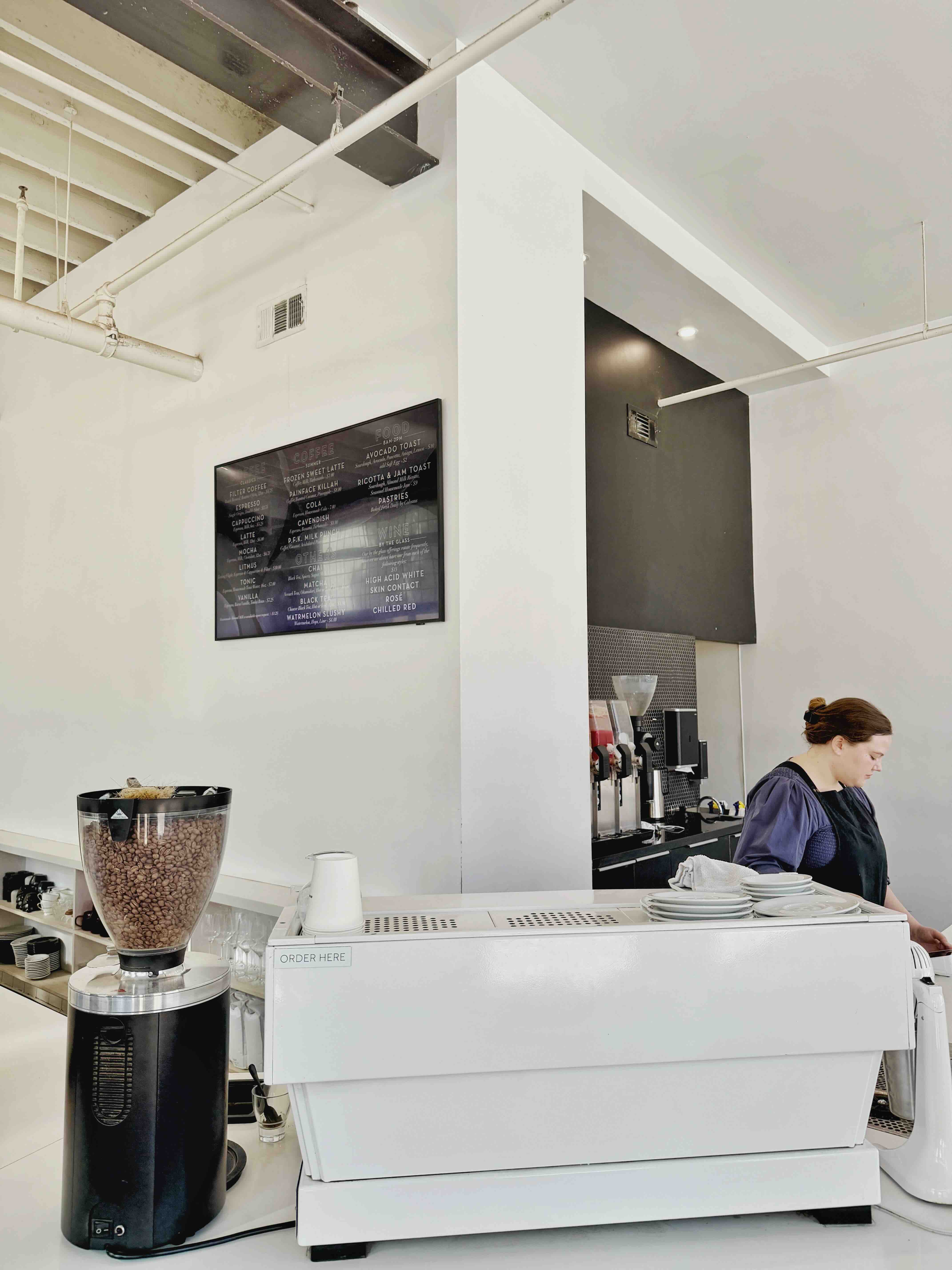 Barista pulling an espresso shot at Hopper & Burr in Downtown Santa Ana.