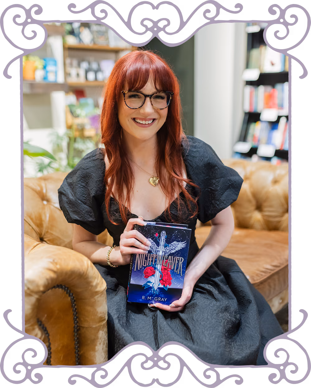 R.M. Gray sitting with her book Nightweaver