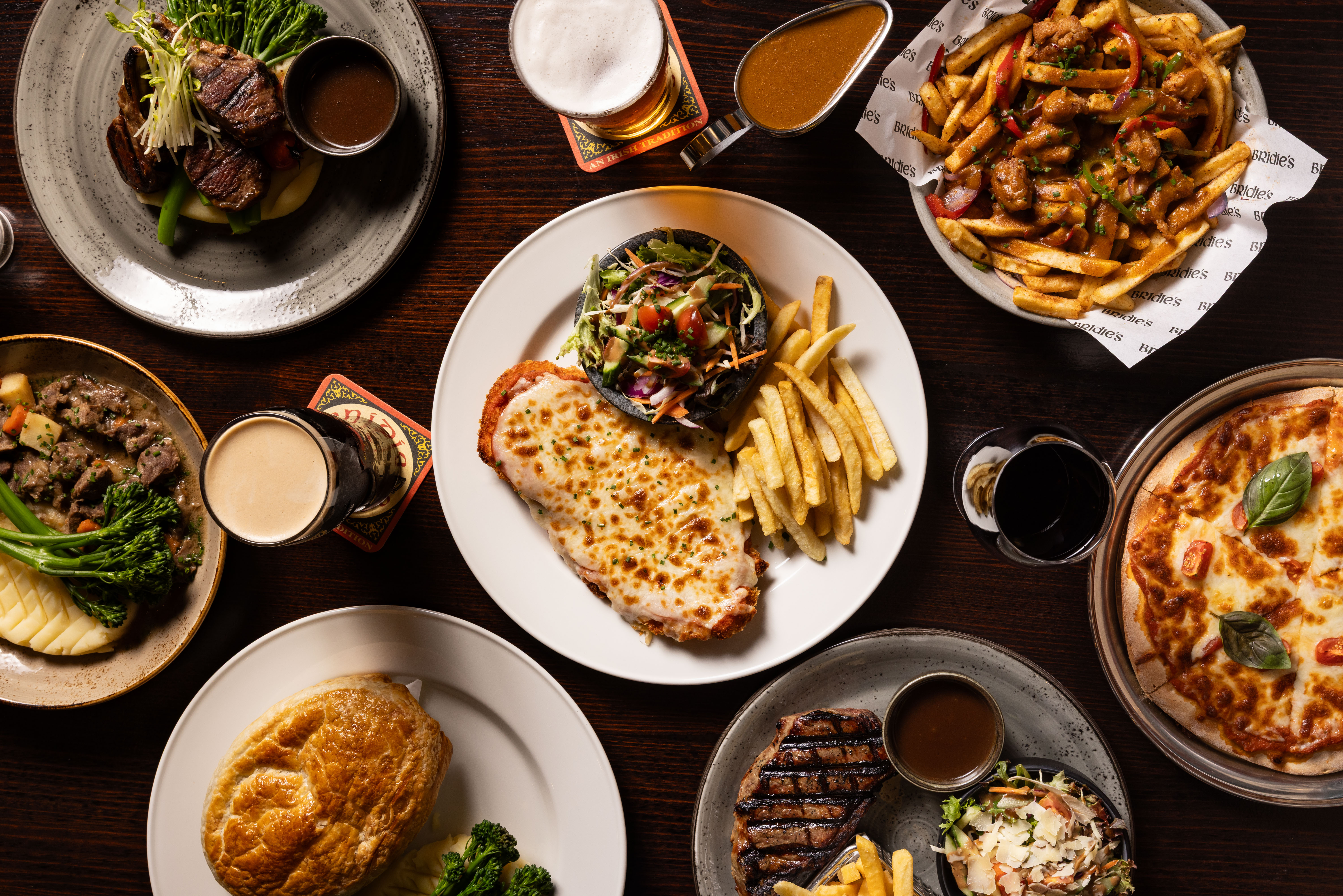 Crispy Calamari Rings, Oysters, Warm Beef Salad, and Chips.