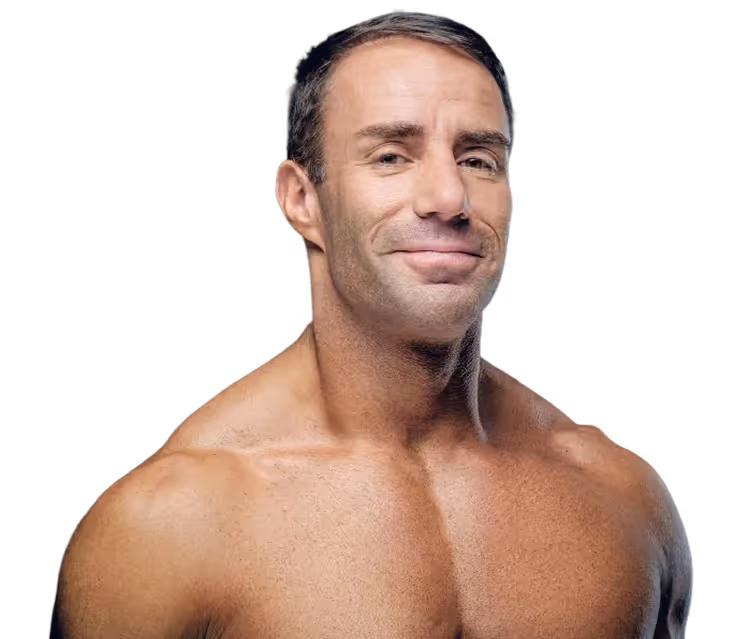 Muscular shirtless man with short dark hair looking confidently at the camera against a black background.