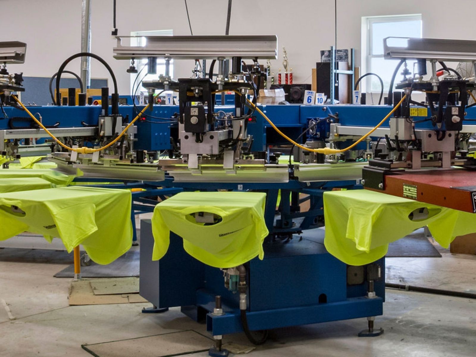 Screen printing press running a job in the Thornville shop