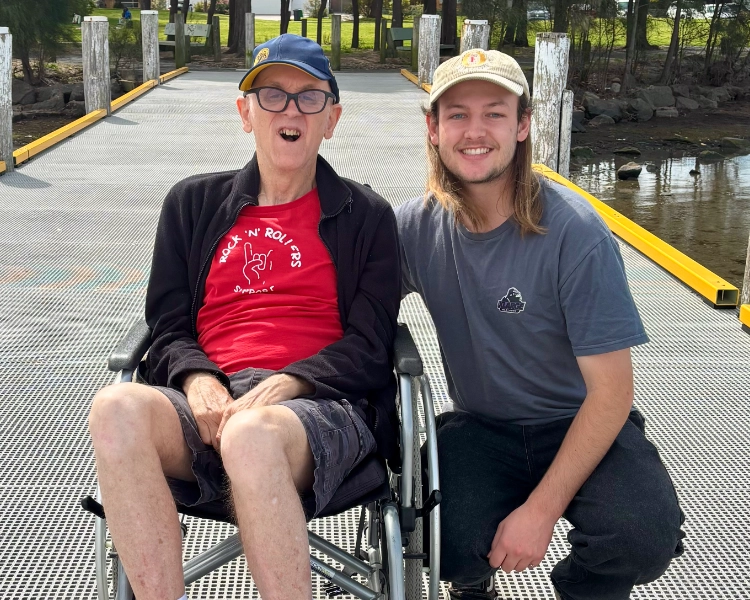 Robbie and his support worker taking a walk