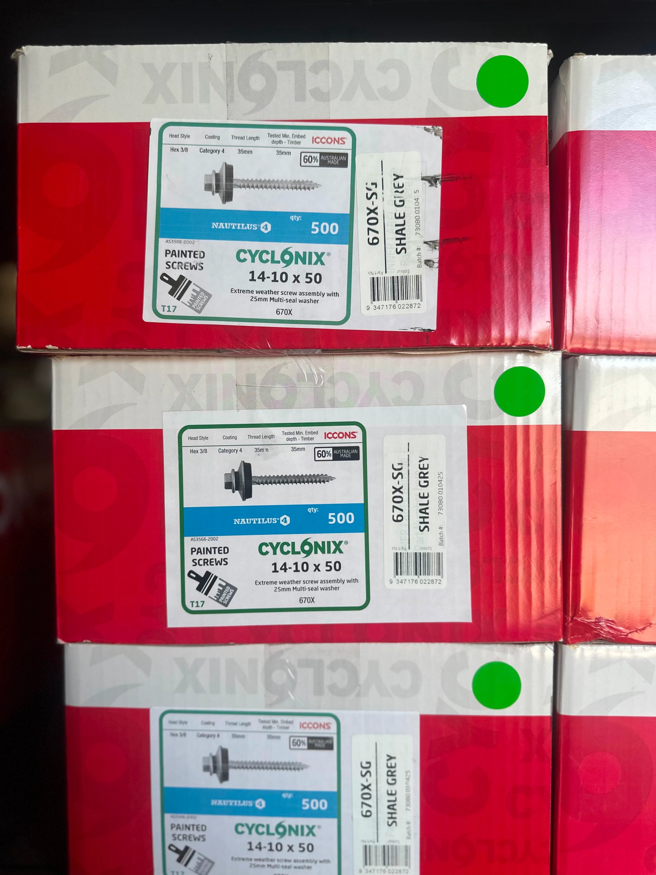 Stacked boxes of Cyclonix 14-10 x 50 painted screws, labeled SHALE GREY, each containing 500 screws with multi-seal washer.