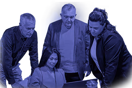 Four diverse professionals gathered around a laptop, engaged in a collaborative discussion.