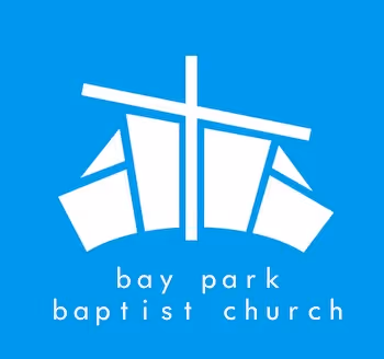 White abstract church building with a cross above and text 'bay park baptist church' on blue background.