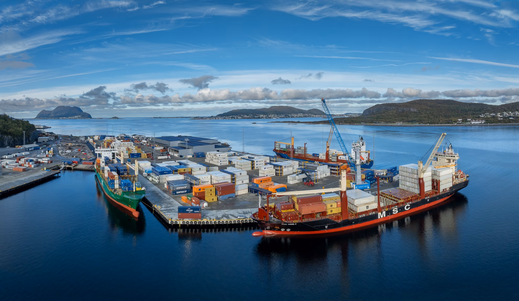 Container ships at Flatholmen terminal with the fjord in the background