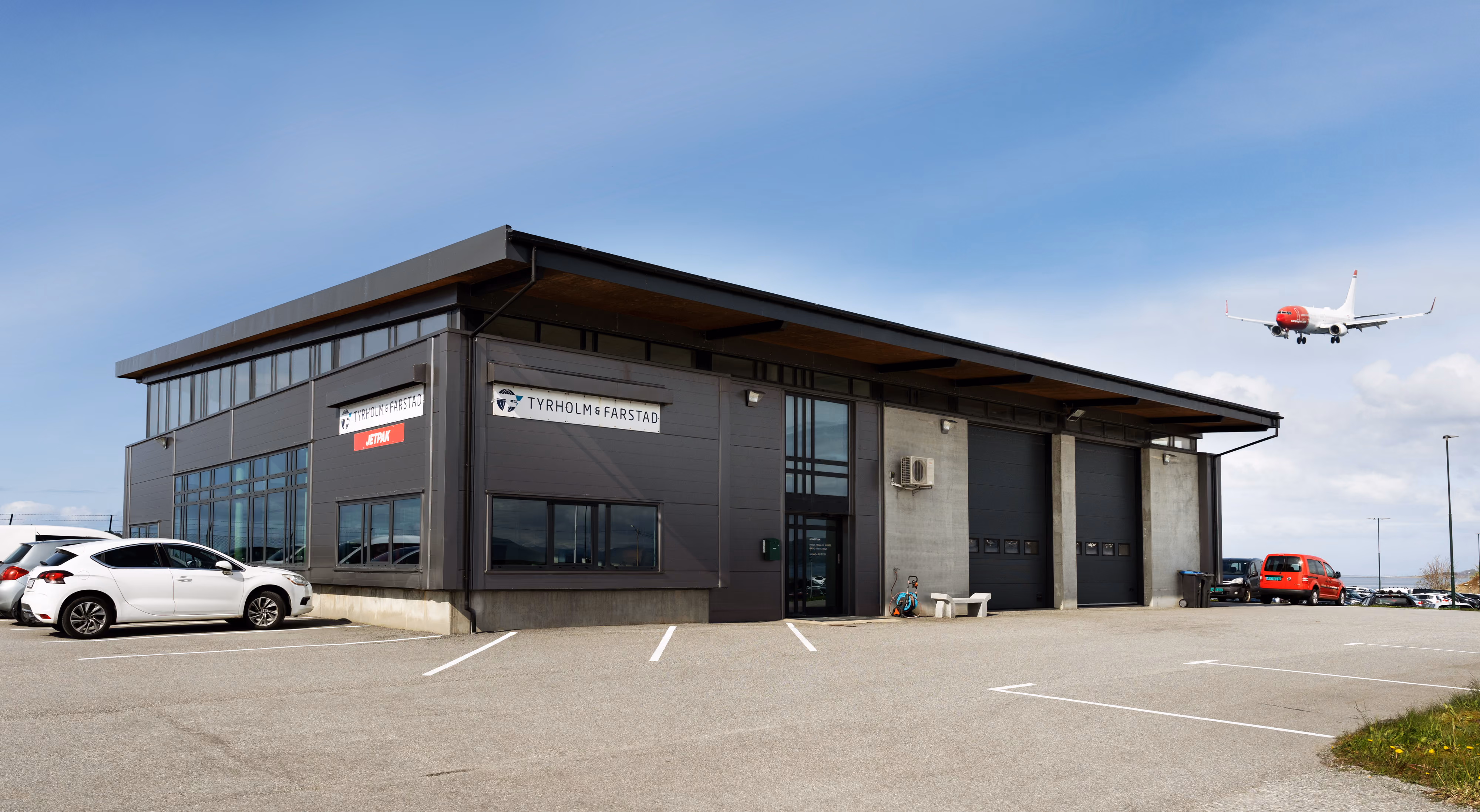 Tyrholm & Farstad’s cargo terminal at Vigra with an aircraft in the background
