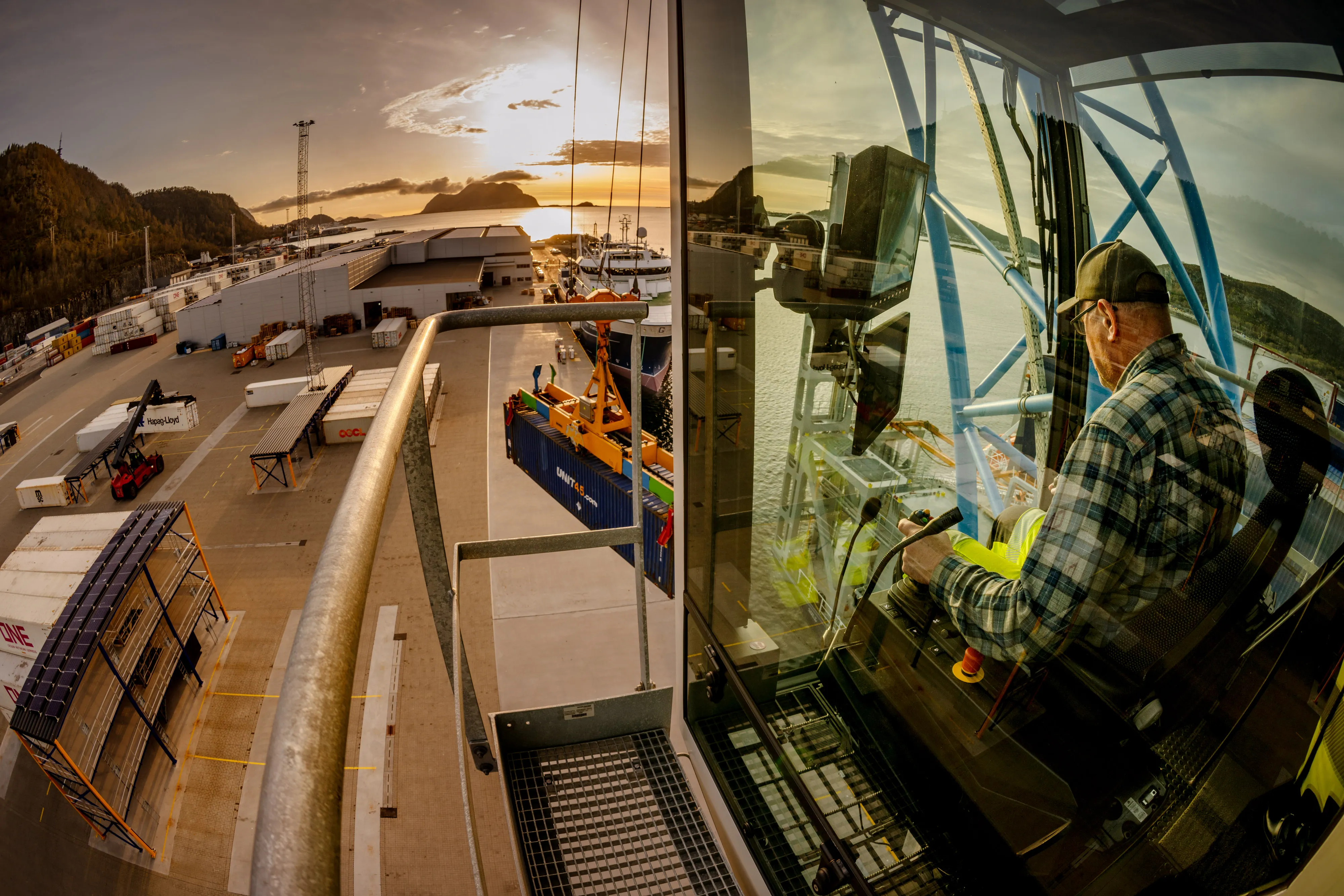 Crane operator working in the cab overlooking the terminal
