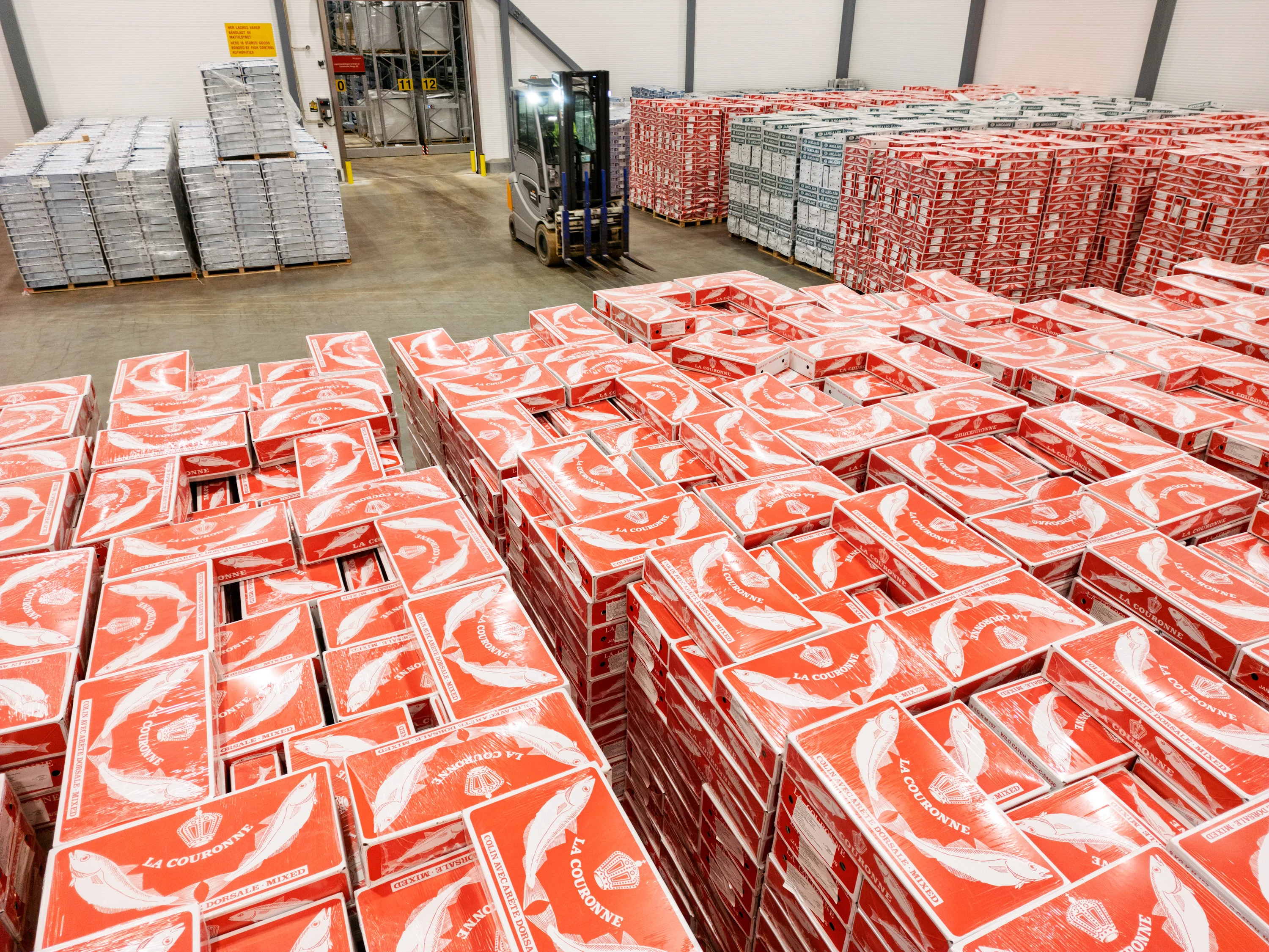 Stacked pallets of packaged goods in the warehouse