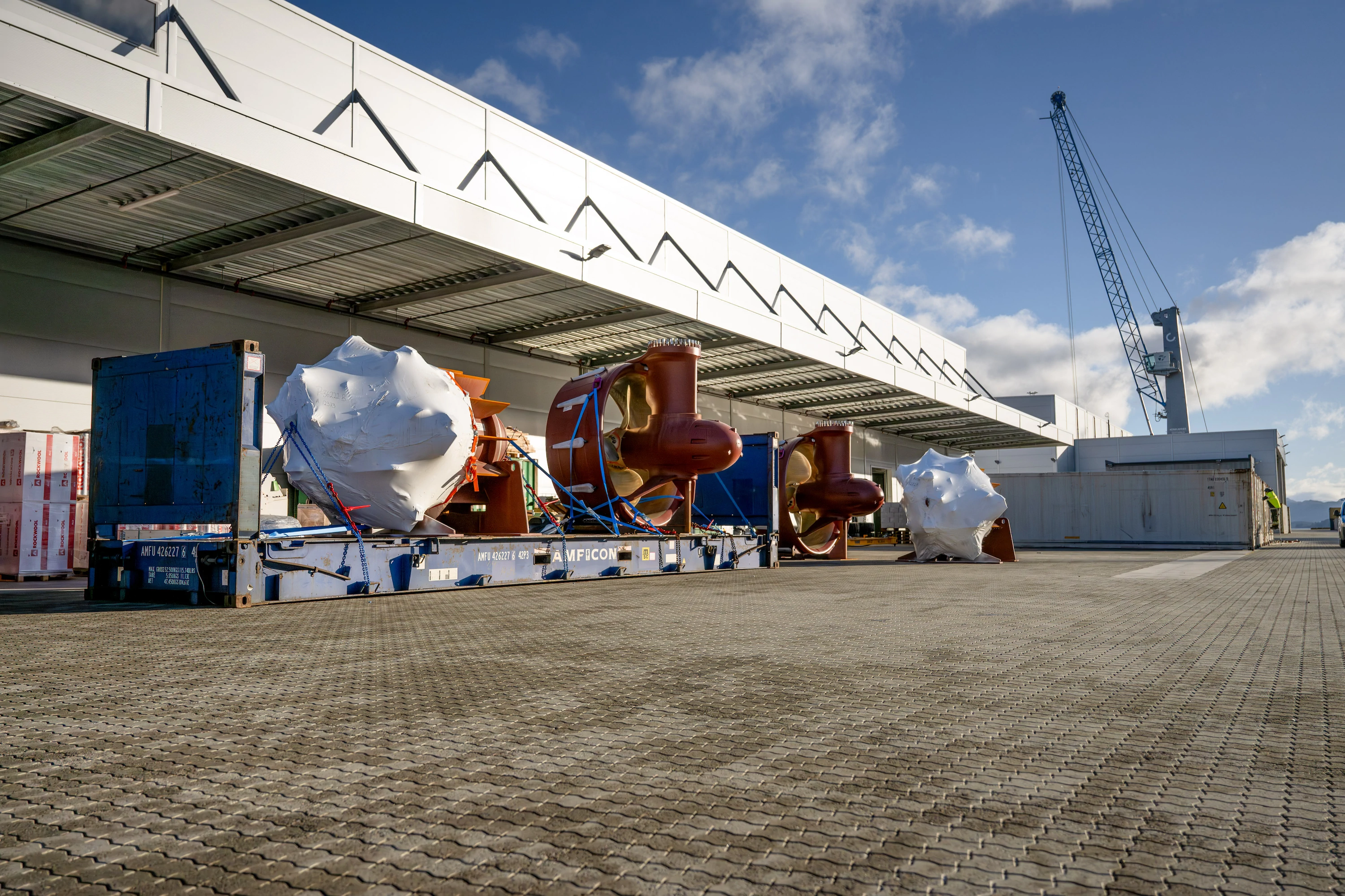 Large ship propellers prepared for transport at the terminal