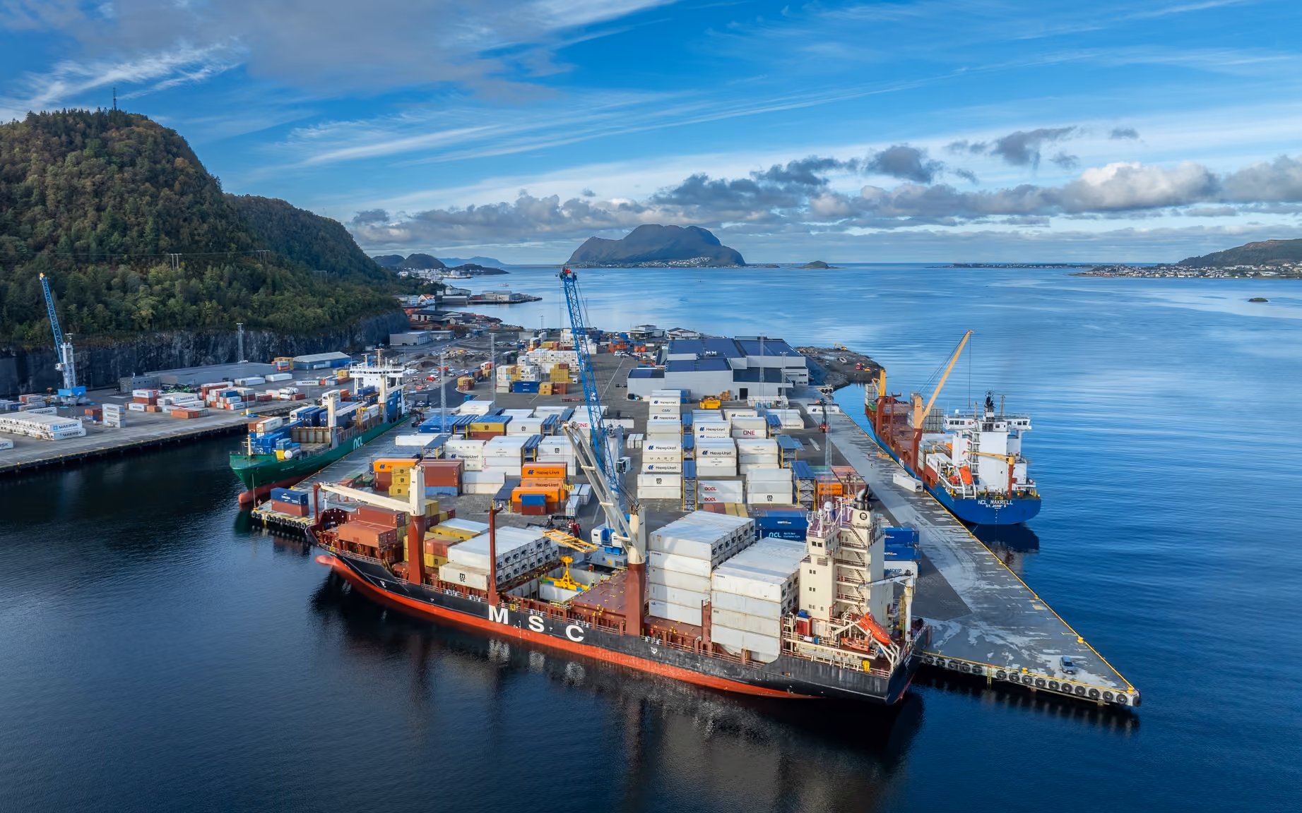 Aerial view of a container ship docked at Flatholmen terminal
