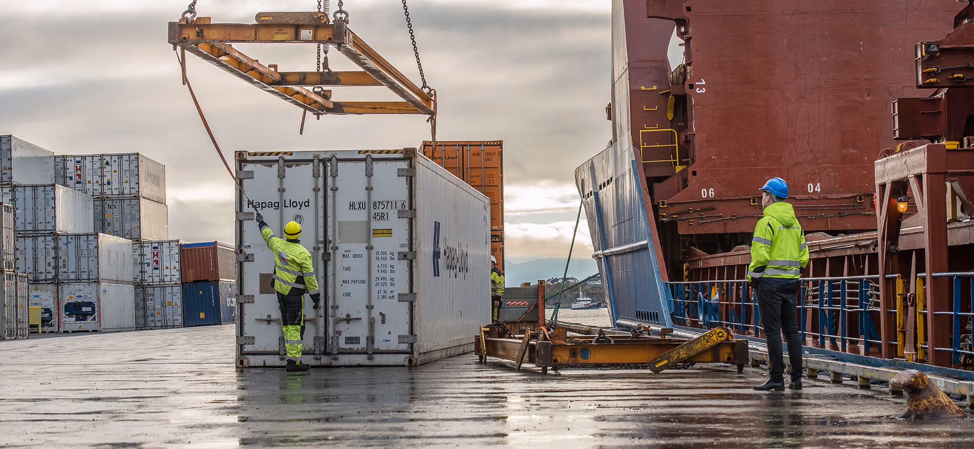 Terminal workers preparing a container for loading