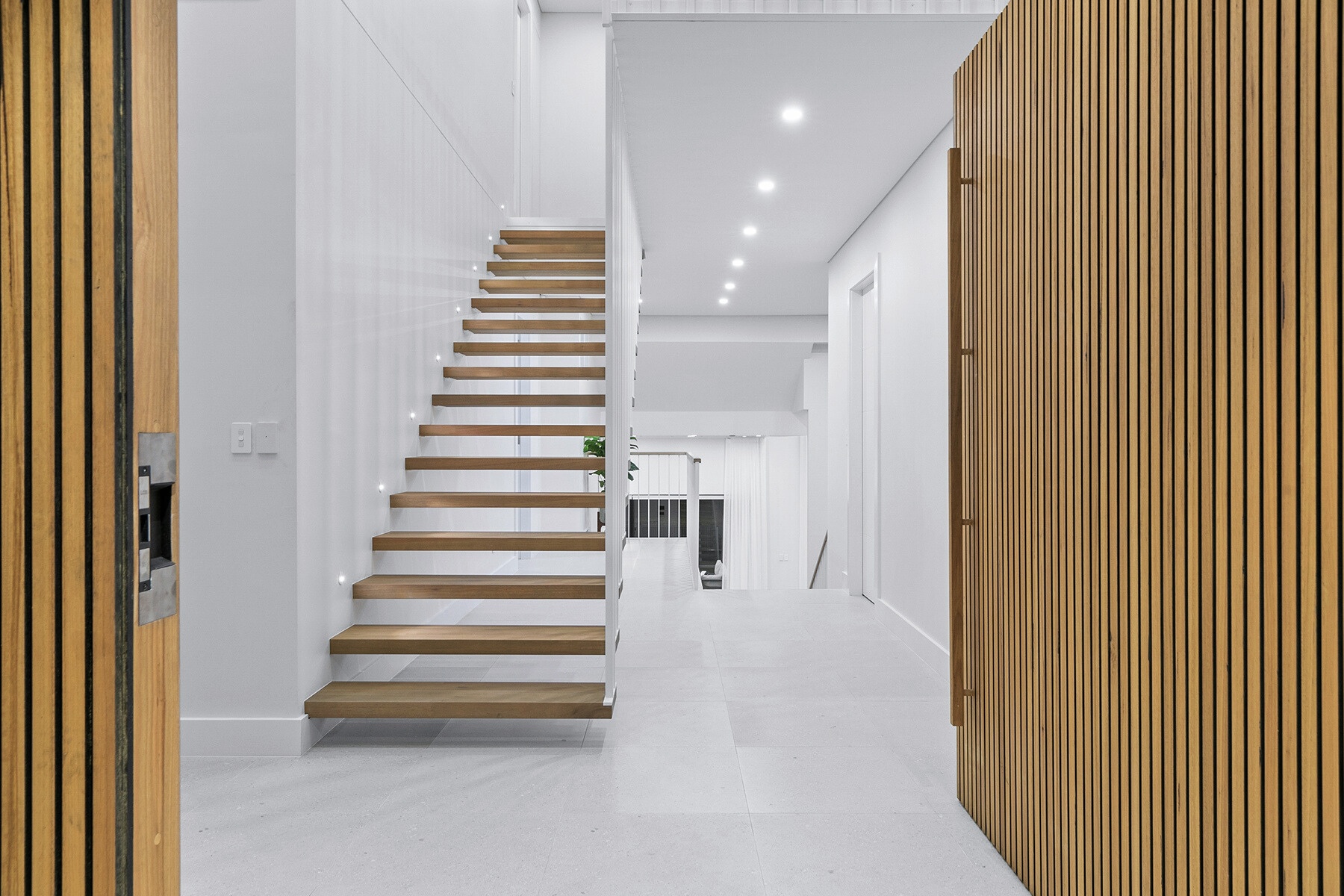 Luxury entrance hall steel staircase by INOX Construction
