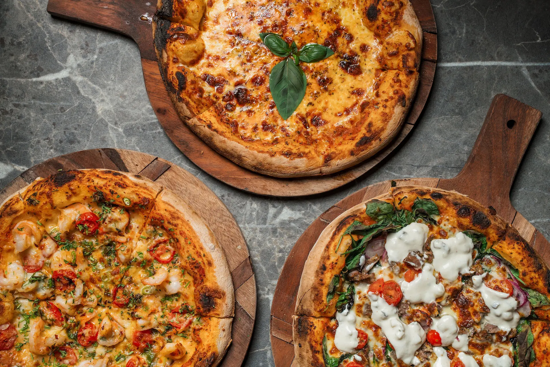 Woodfired pizza Melbourne style, artisan Italian pizza with crispy crust, mozzarella cheese, and fresh toppings.