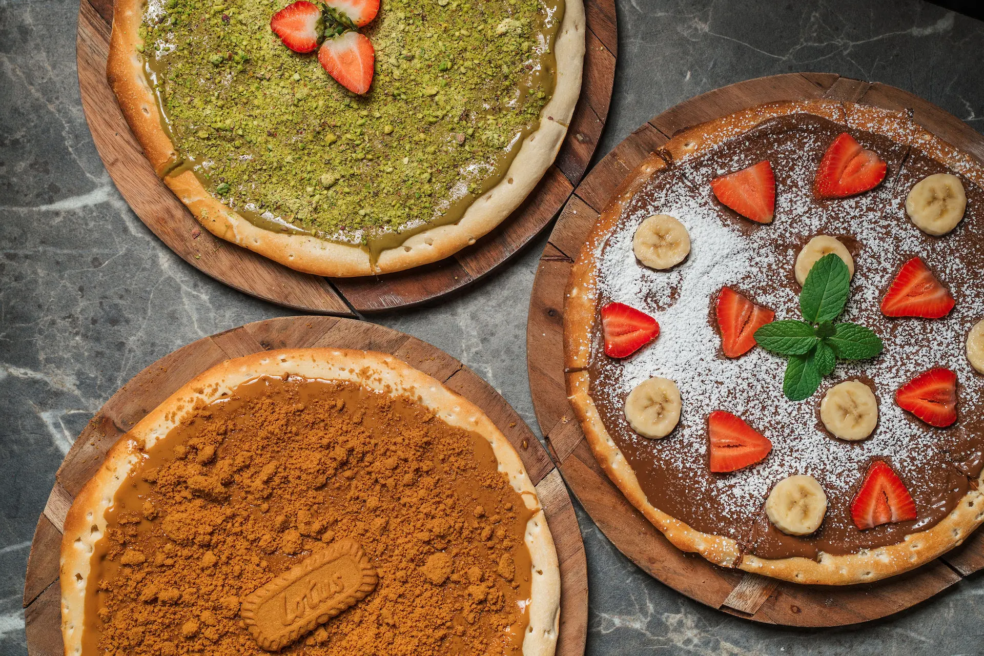 Dessert pizza restaurant dish, sweet pizza with chocolate and fruit toppings served fresh.