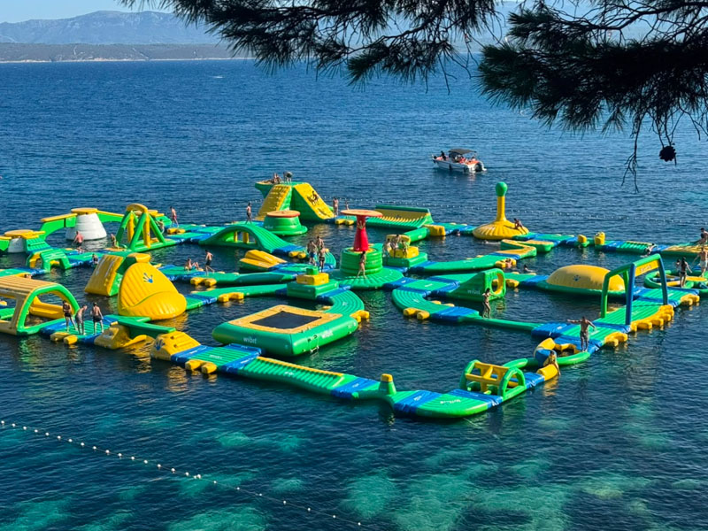 A big green and yellow inflatable water park