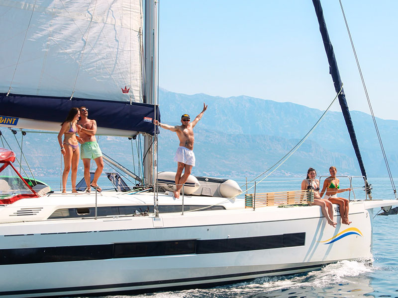 Founder Jack poses on one of the yachts accompanied by other guests on the 2026 ctrl.alt sail trip to croatia