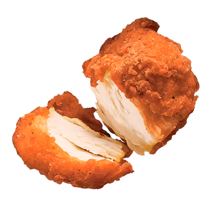 Two pieces of crispy fried chicken, one split to show white meat inside.