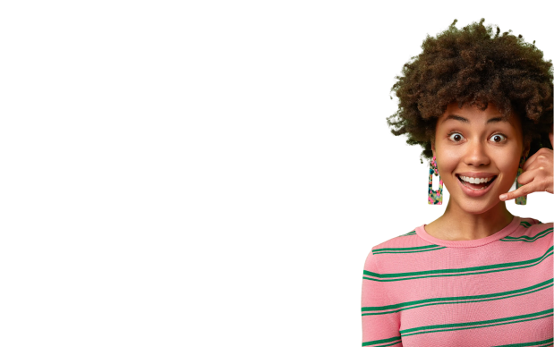 a woman with curly hair wearing pink and green striped shirt